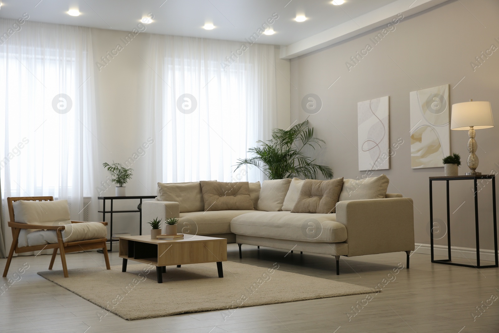 Photo of Big comfortable sofa in living room. Interior design