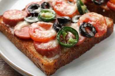 Tasty pizza toast on table, closeup view