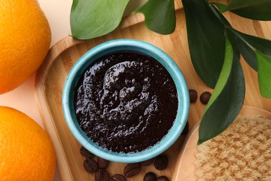 Photo of Flat lay composition with natural body scrub and fresh ingredients on beige background. Anti cellulite treatment