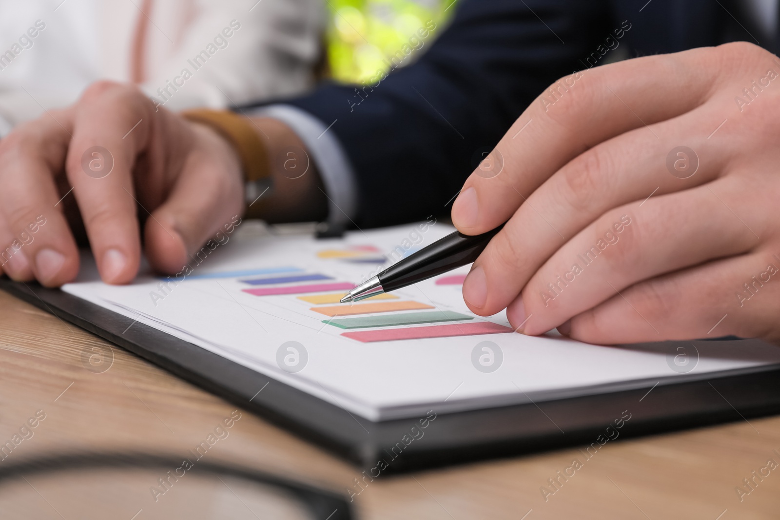 Photo of Business people working with documents at table in office, closeup. Investment analysis