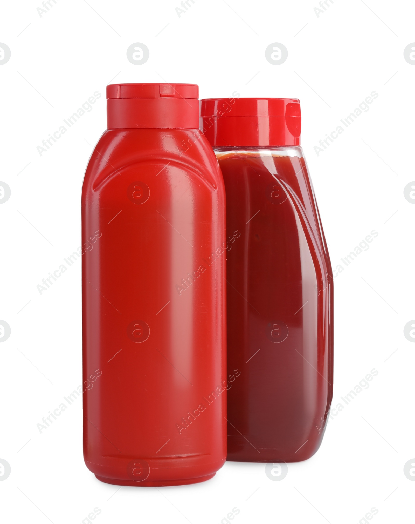 Photo of Different bottles of ketchup on white background