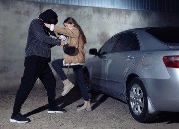 Photo of Woman defending herself from attacker on parking lot