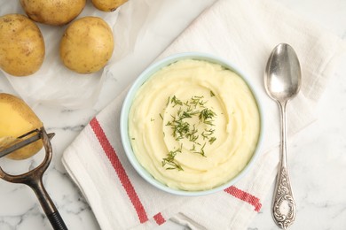 Photo of Freshly cooked homemade mashed potatoes and raw vegetables on white marble table, flat lay