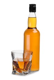 Glass and bottle of whiskey isolated on white