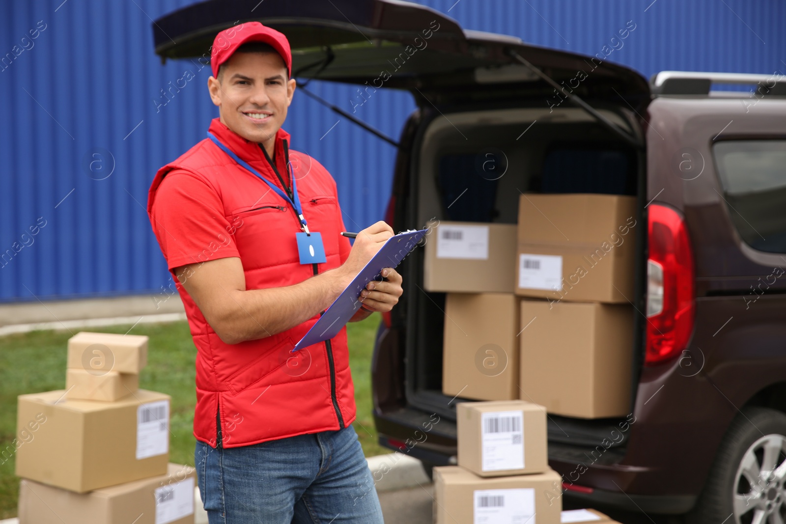 Photo of Courier with clipboard near car outdoors, space for text