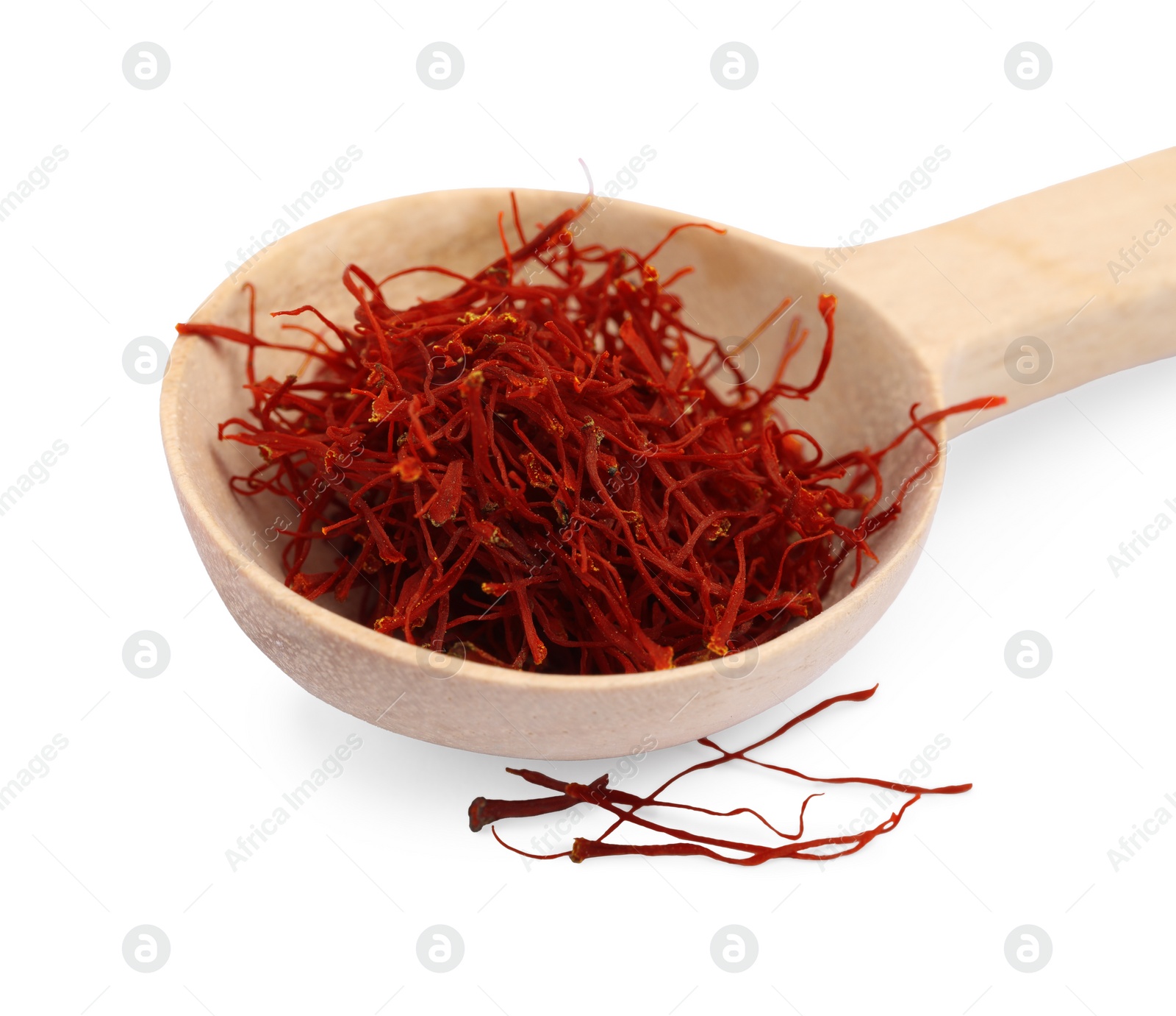 Photo of Wooden spoon of dried red saffron isolated on white