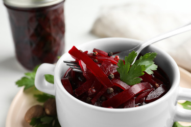 Photo of Delicious pickled beets on table, closeup view