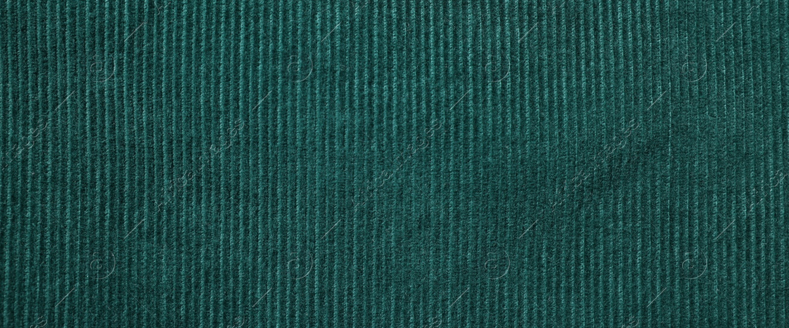 Photo of Texture of dark green fabric as background, top view