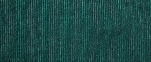Photo of Texture of dark green fabric as background, top view
