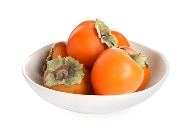 Photo of Bowl with delicious persimmons isolated on white