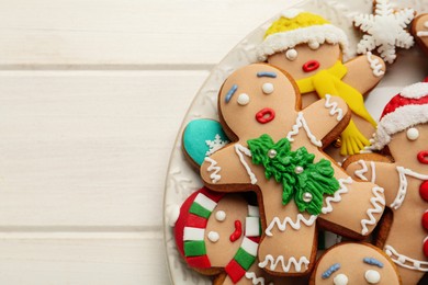 Delicious Christmas cookies on white wooden table, top view. Space for text