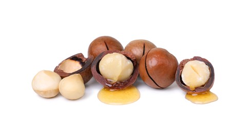 Photo of Delicious organic Macadamia nuts isolated on white