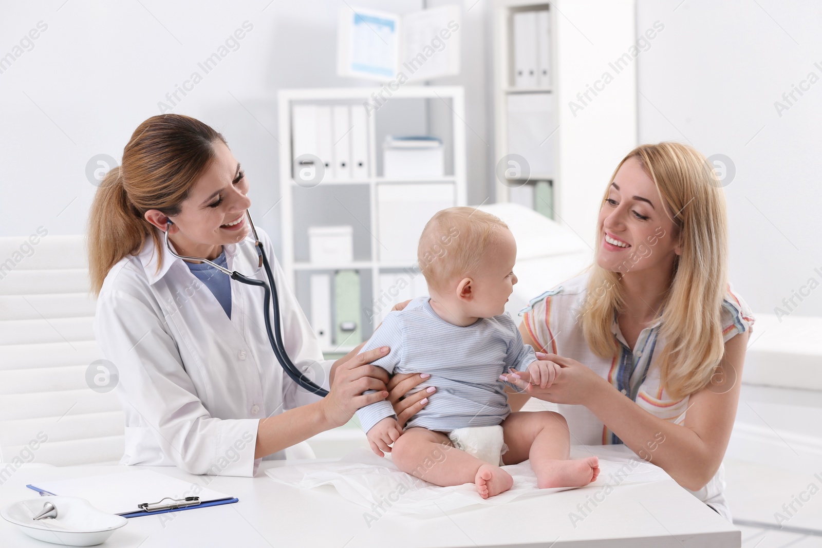 Photo of Woman with her baby visiting children's doctor in hospital