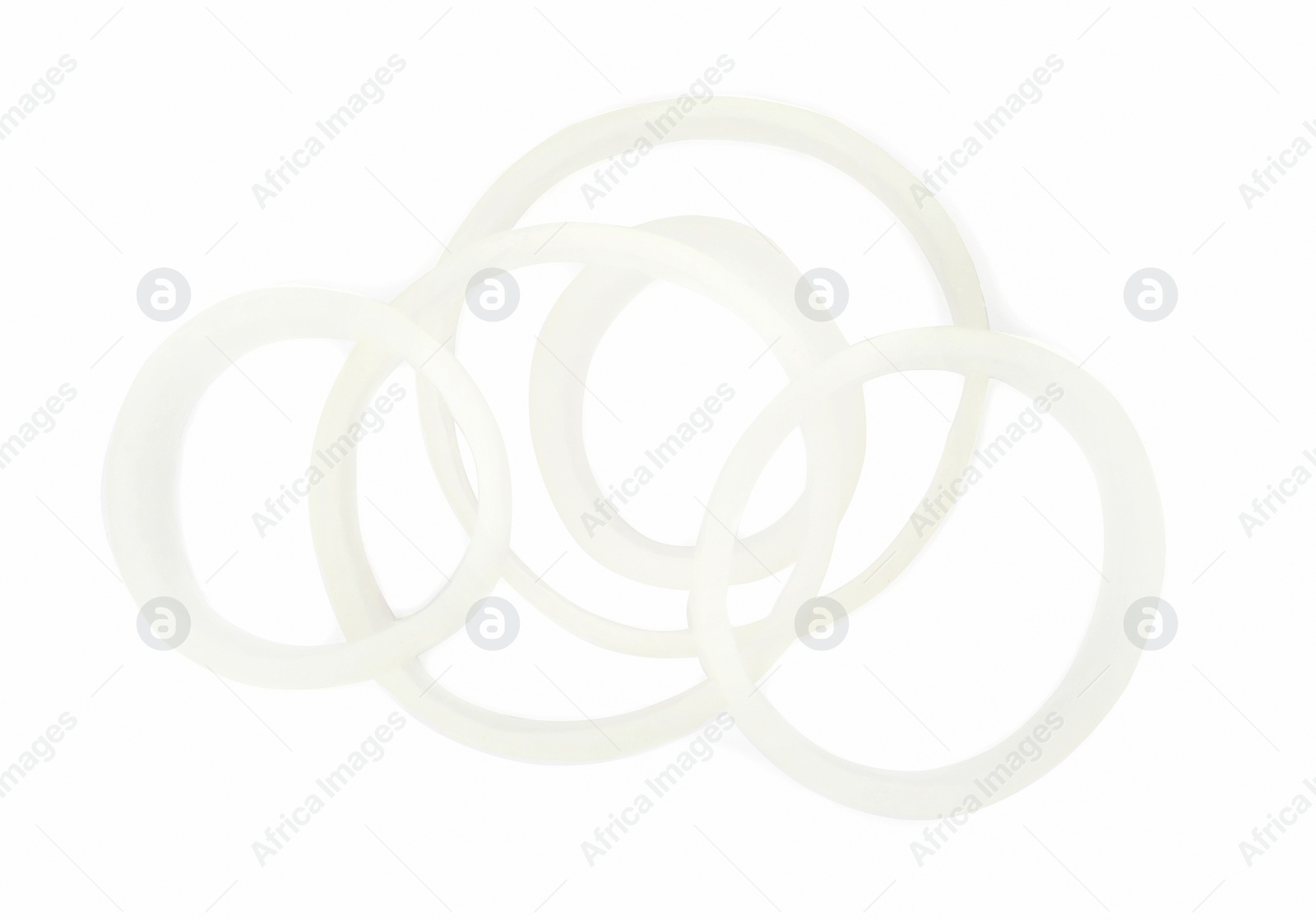 Photo of Fresh raw onion rings isolated on white, top view