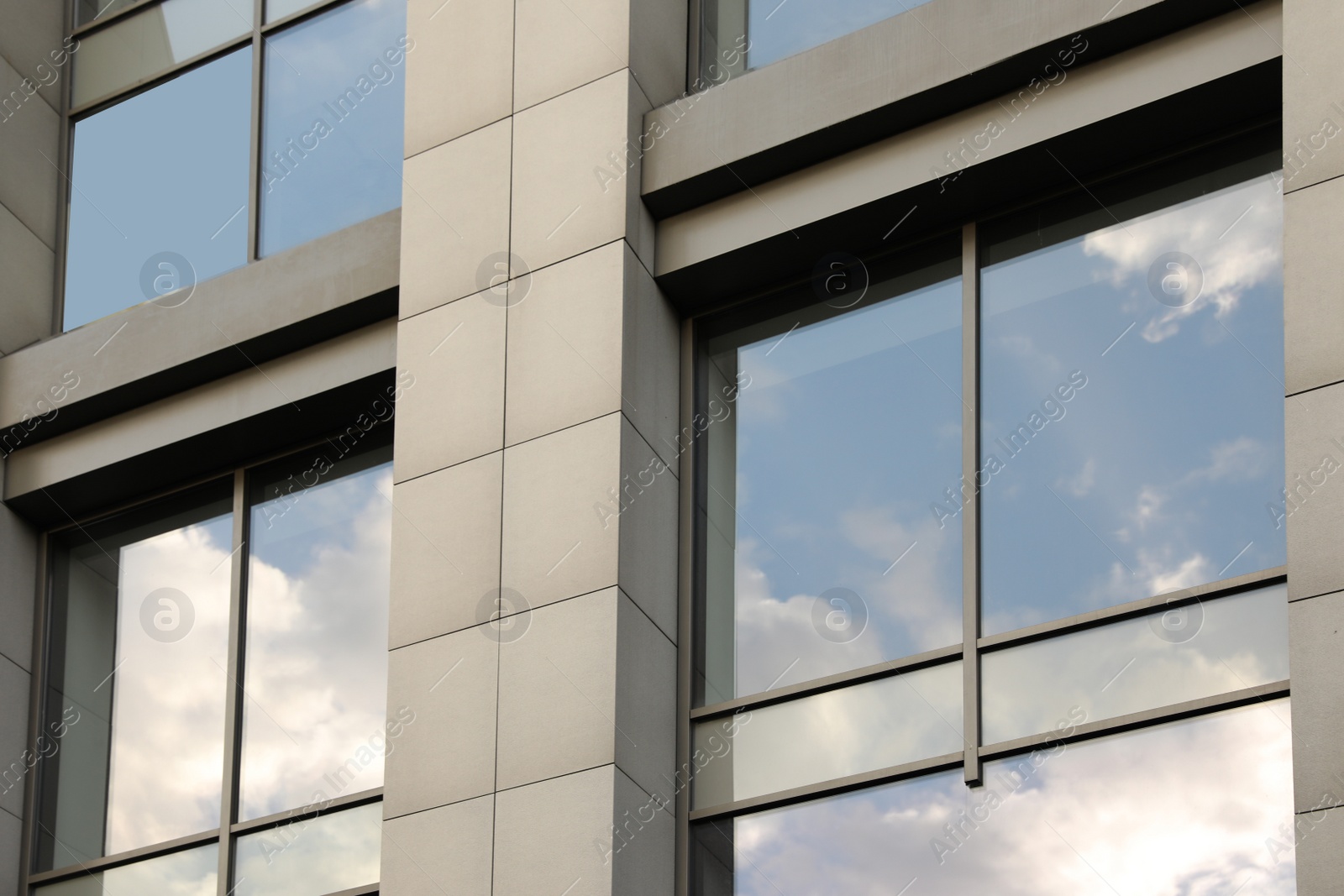 Photo of Modern office building with tinted windows. Urban architecture