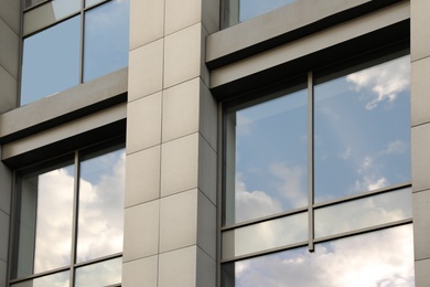 Modern office building with tinted windows. Urban architecture