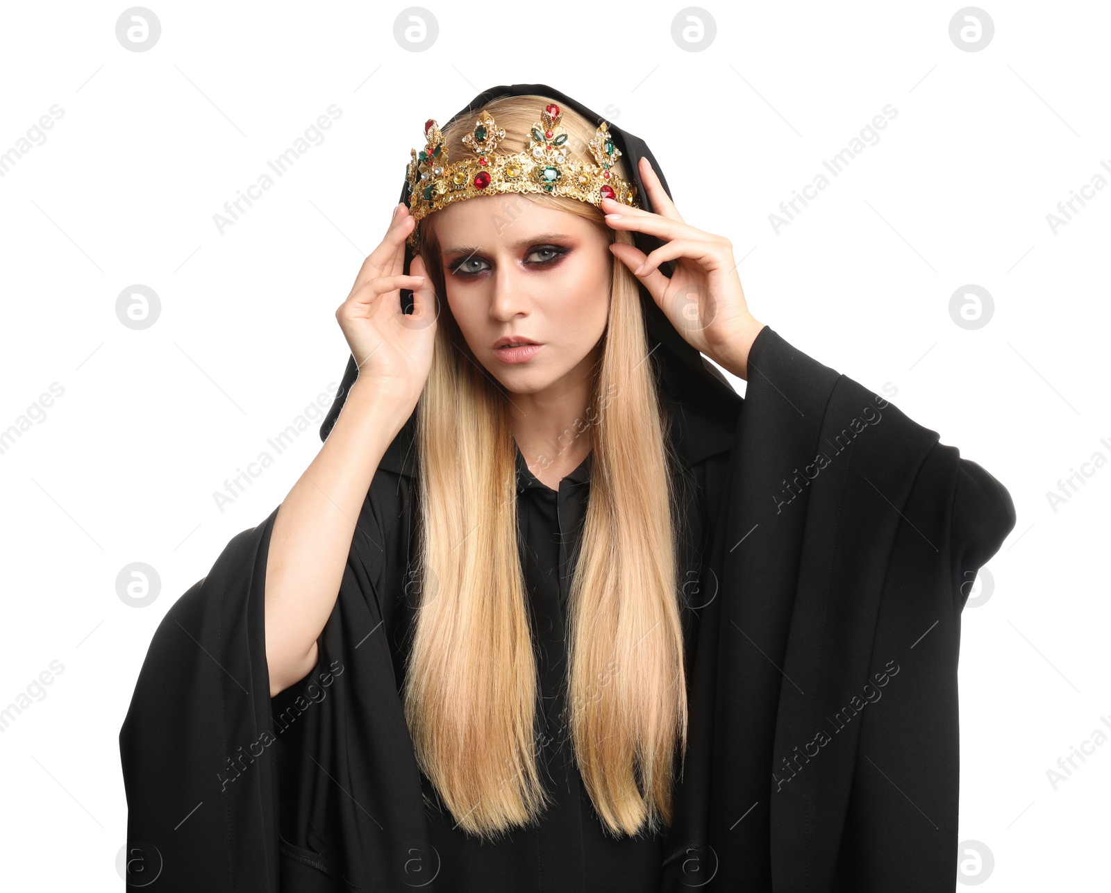Photo of Witch in black mantle and crown isolated on white. Scary fantasy character