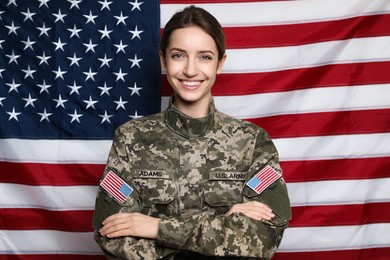 Photo of Portrait of happy female cadet against American flag