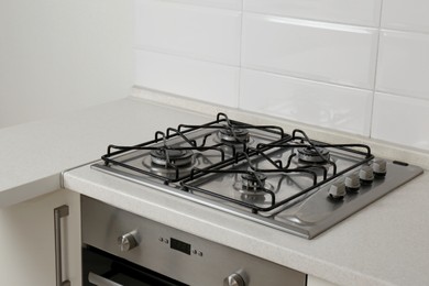 Photo of New gas stove and oven in stylish kitchen