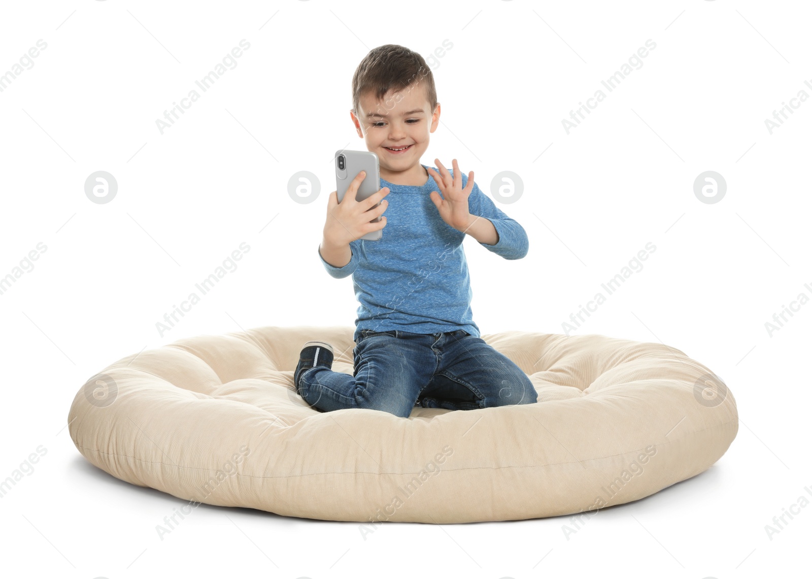 Photo of Little boy using video chat on smartphone, white background