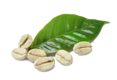 Green coffee beans and fresh leaf on white background