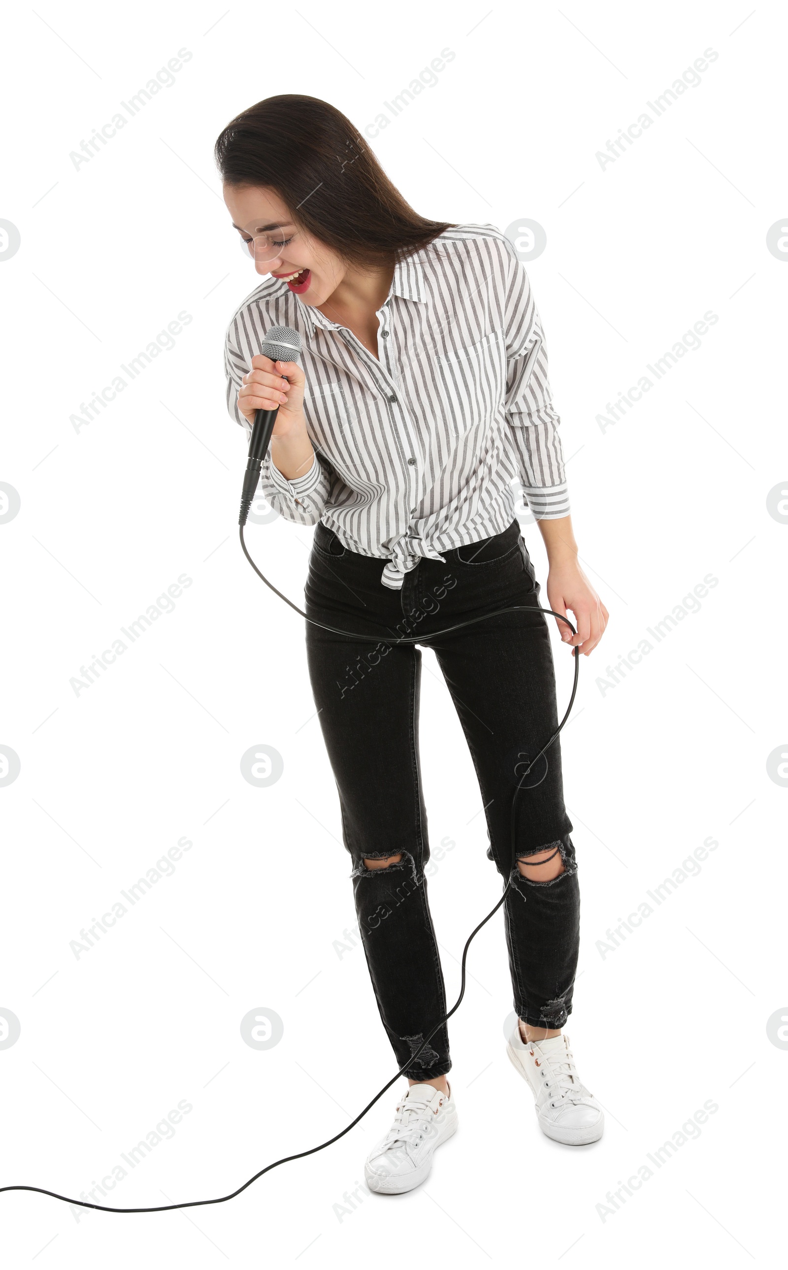 Photo of Young woman wearing casual clothes singing in microphone on white background