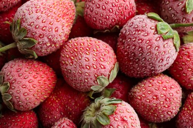 Photo of Tasty frozen strawberries as background, top view