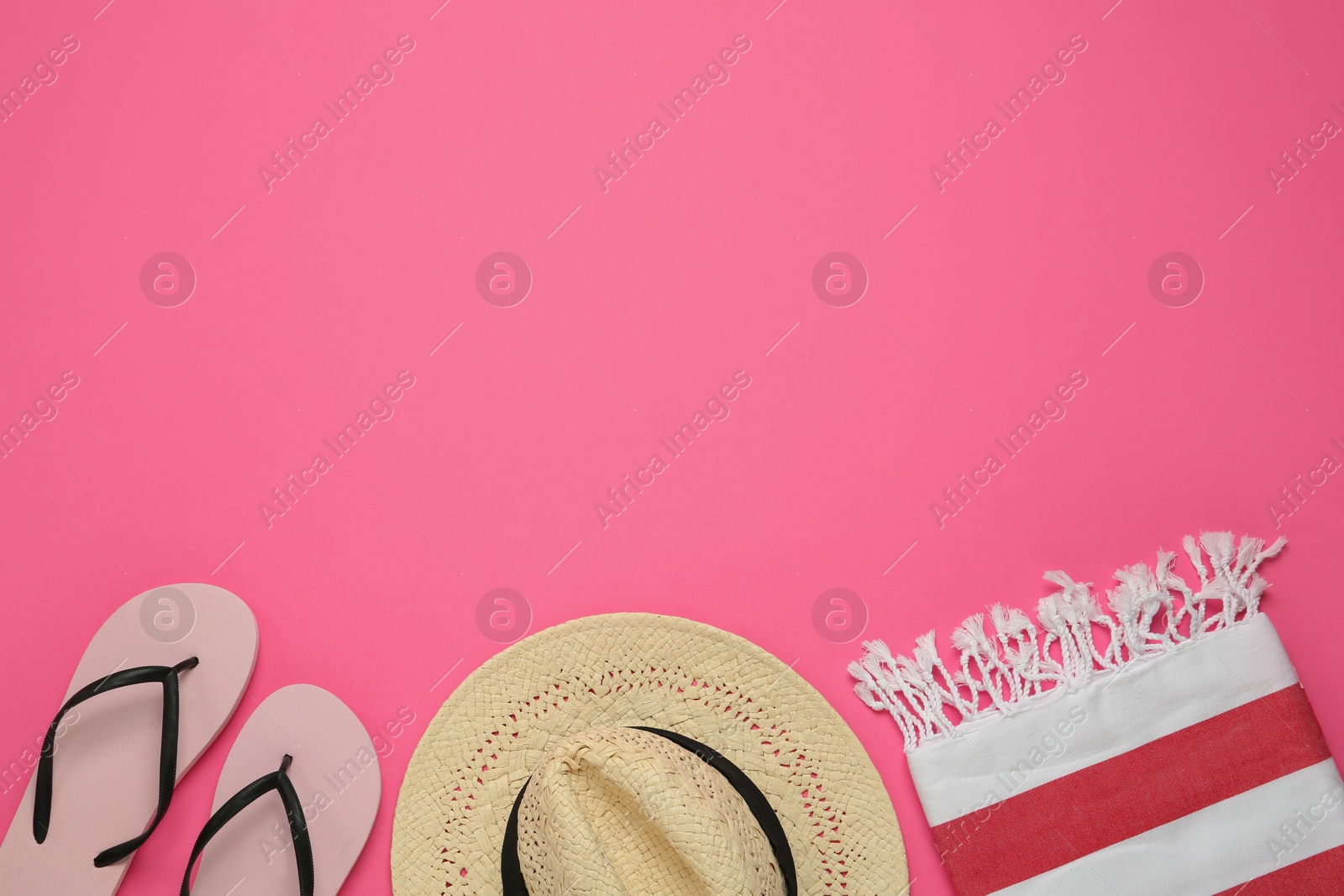 Photo of Flat lay composition with different beach objects on pink background, space for text