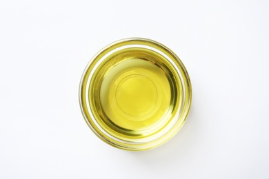 Little bowl with fresh olive oil on white background