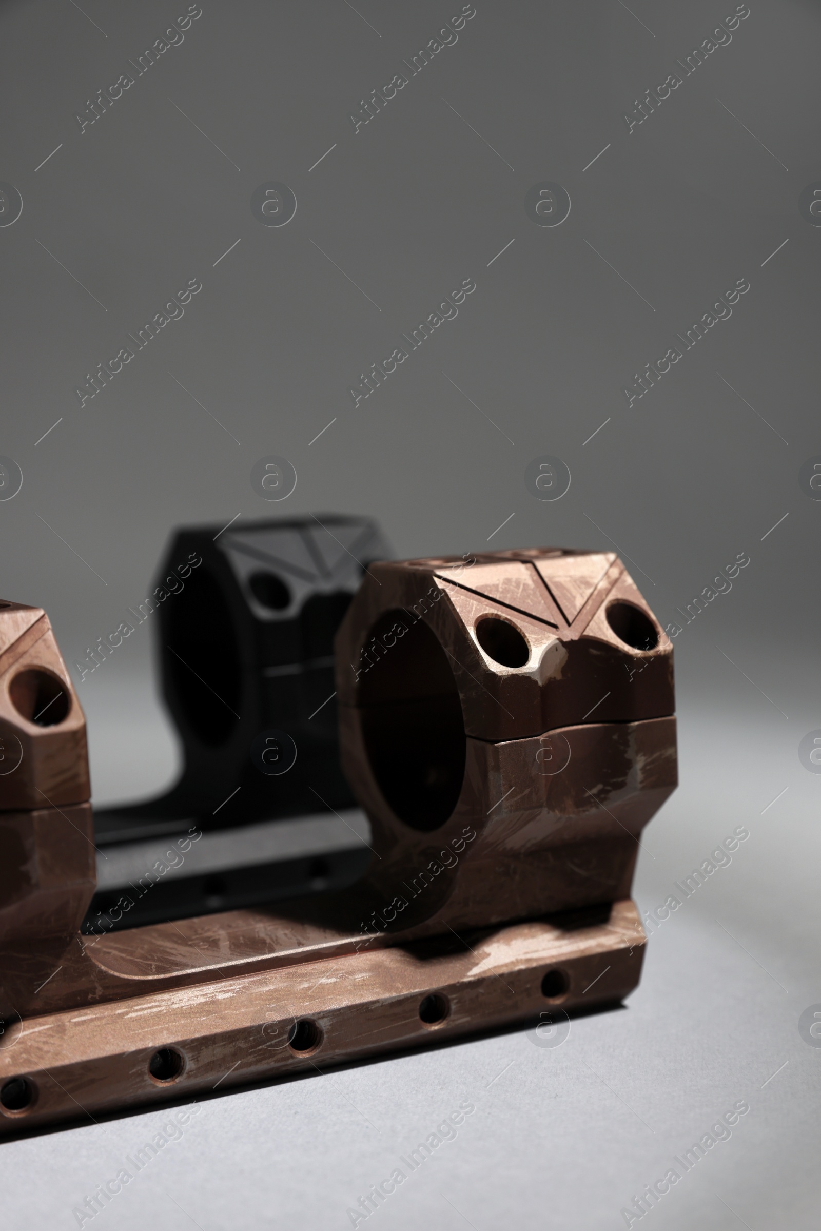 Photo of Quick disconnect sniper cantilever scope mounts on grey table, closeup