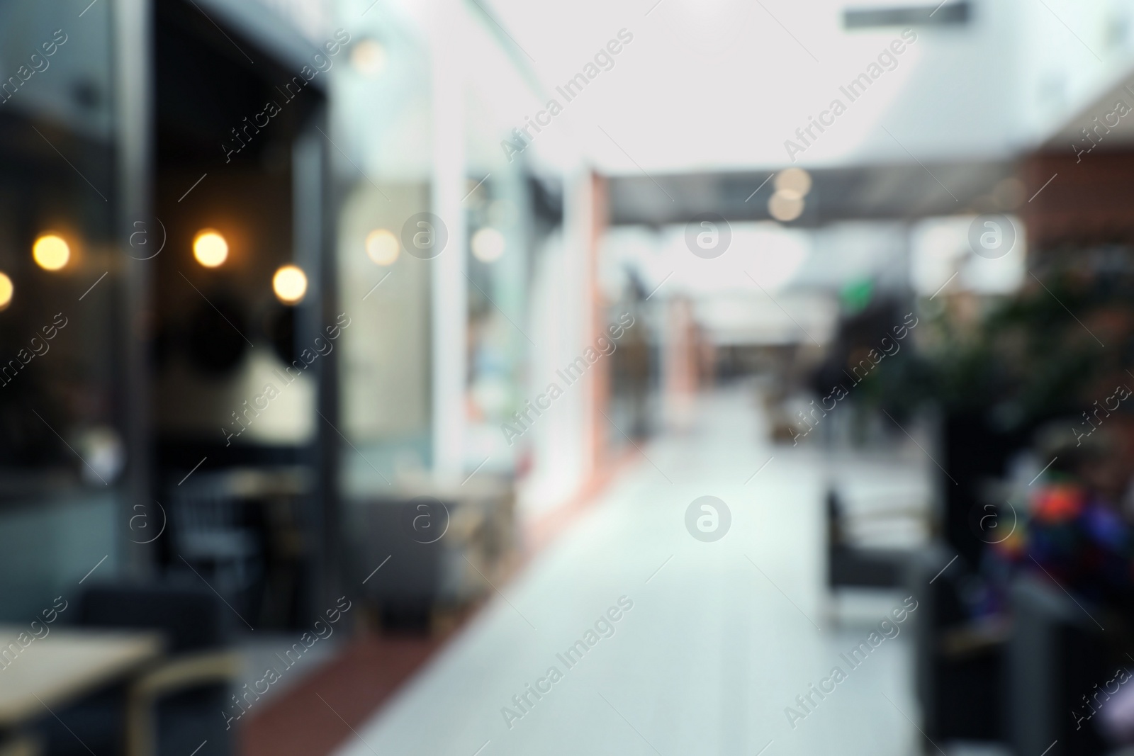 Photo of Blurred view of shopping mall interior. Bokeh effect