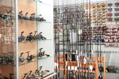 Photo of Fishing equipment in sports shop. Recreational activity