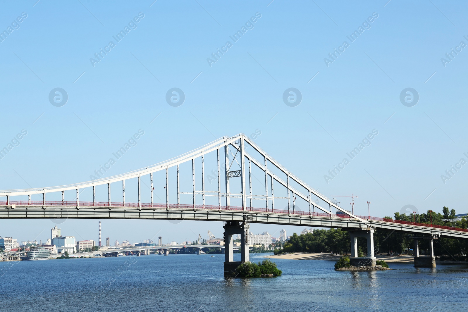 Photo of Beautiful view of suspension bridge over river on sunny day