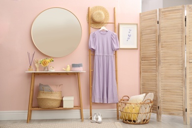 Photo of Elegant round mirror in stylish room interior