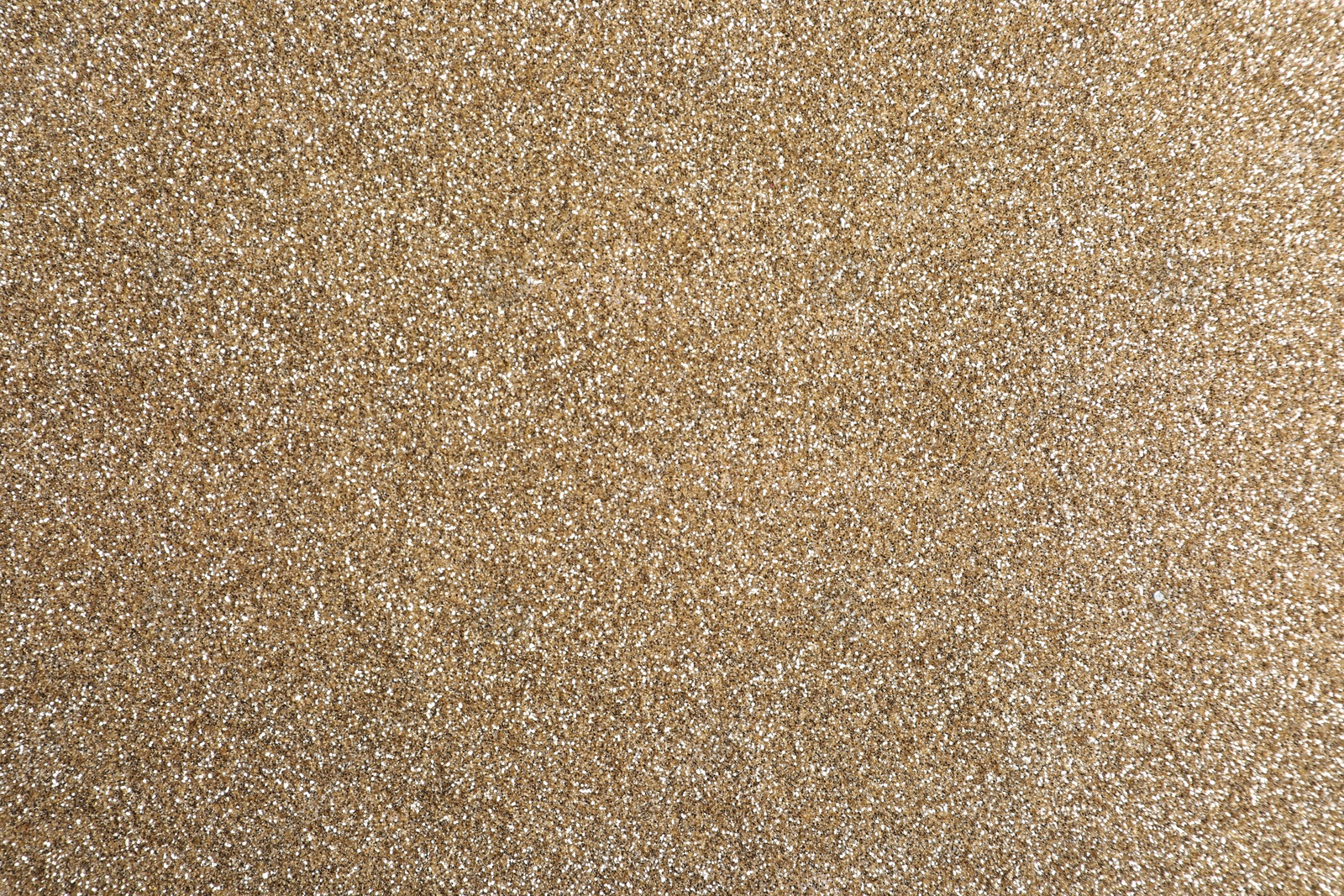 Photo of Shiny light brown glitter as background, closeup
