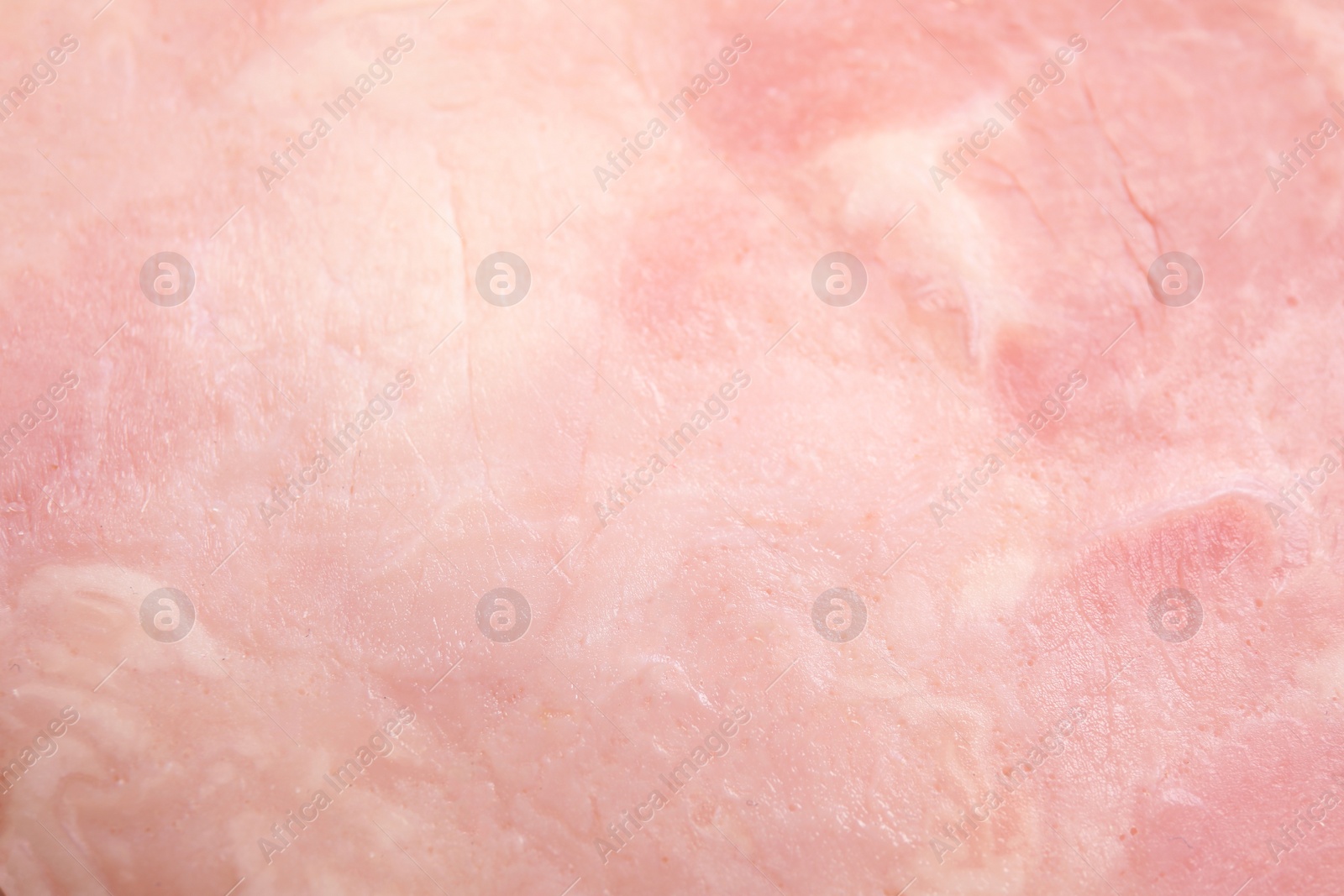 Photo of Tasty ham as background, closeup. Fresh delicacy