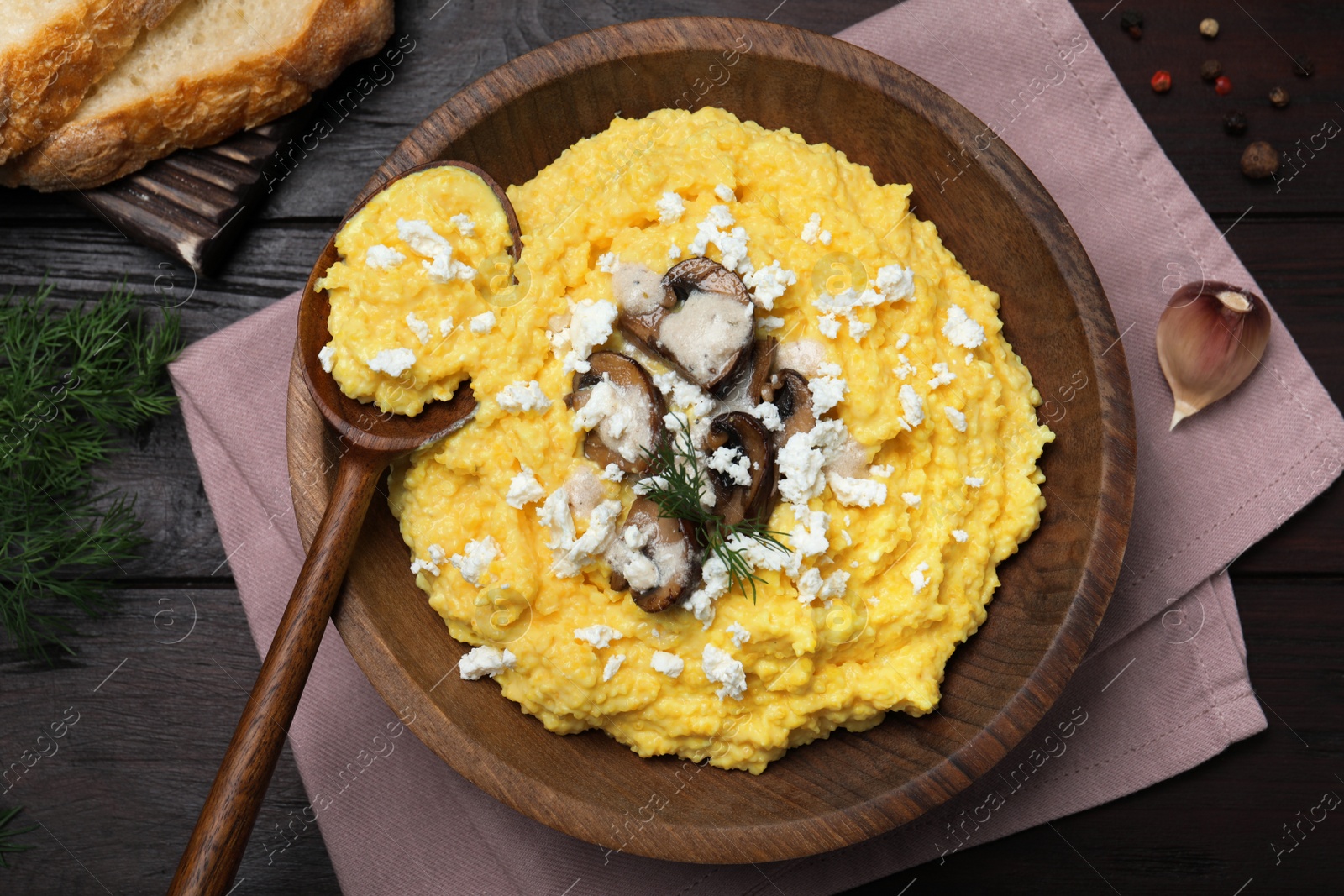 Photo of Delicious traditional banosh served on wooden table, flat lay