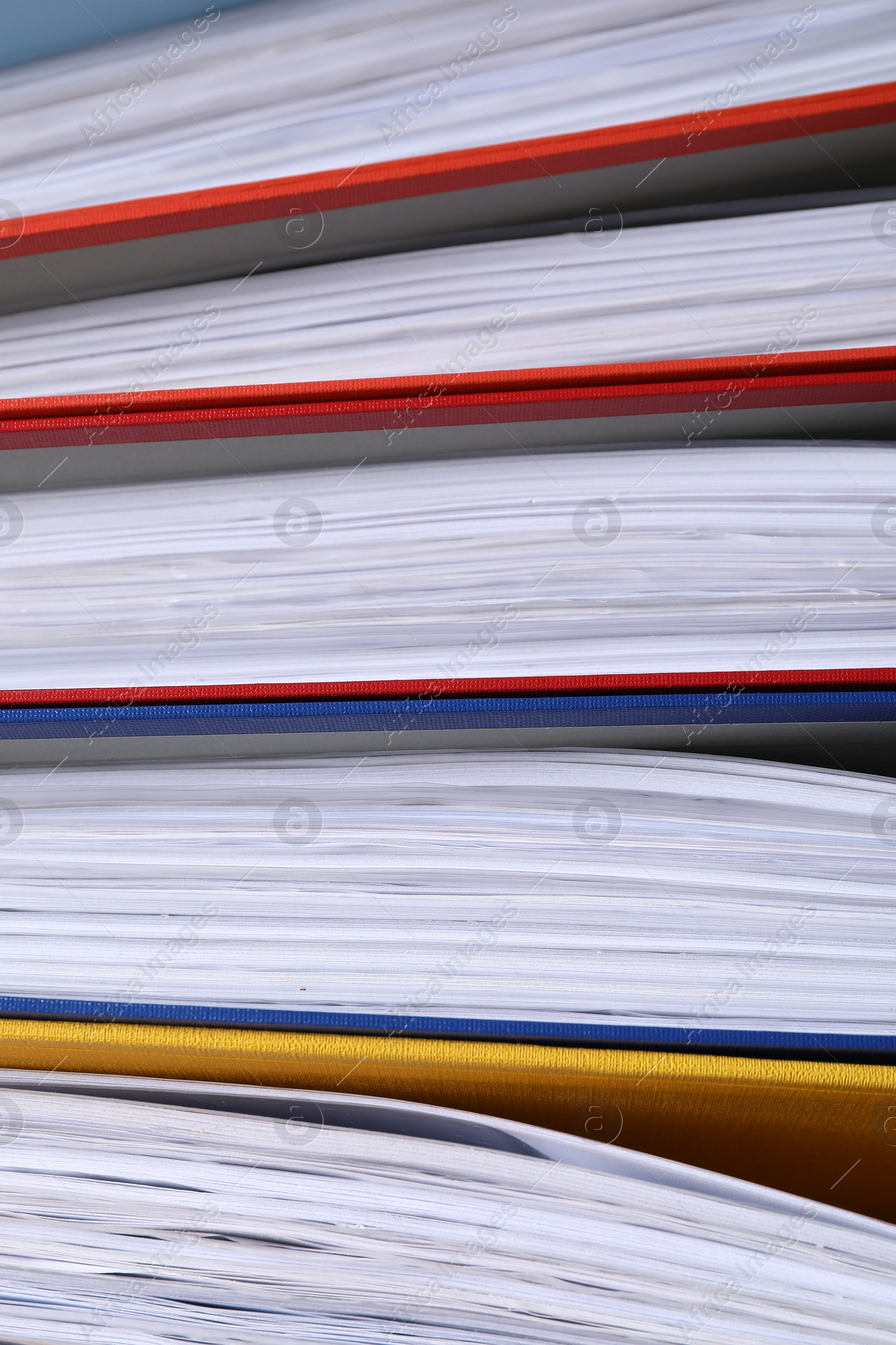 Photo of Colorful binder office folders as background, closeup