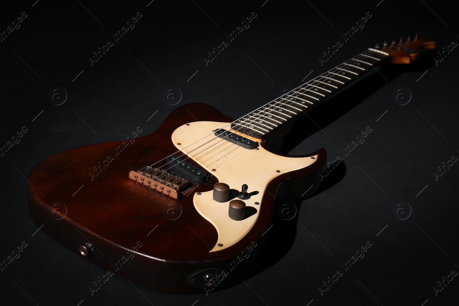 Photo of Electric guitar on black background. Musical instrument