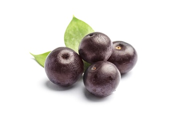 Photo of Fresh acai berries with leaves on white background