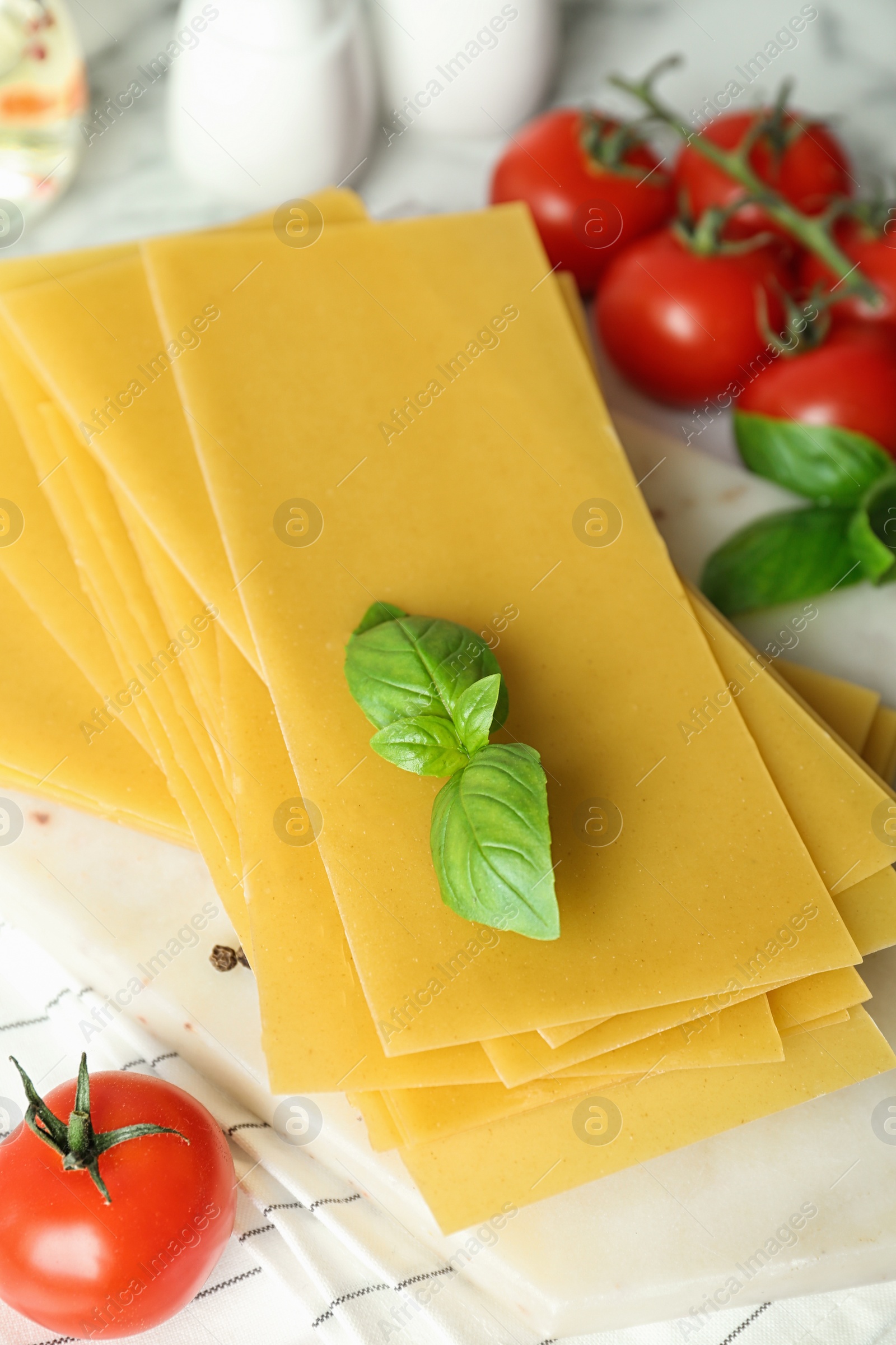 Photo of Composition with uncooked lasagna sheets on table, closeup