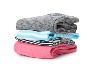 Photo of Stack of colorful children's clothes on white background