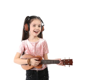 Photo of Portrait of little girl with headphones playing guitar isolated on white
