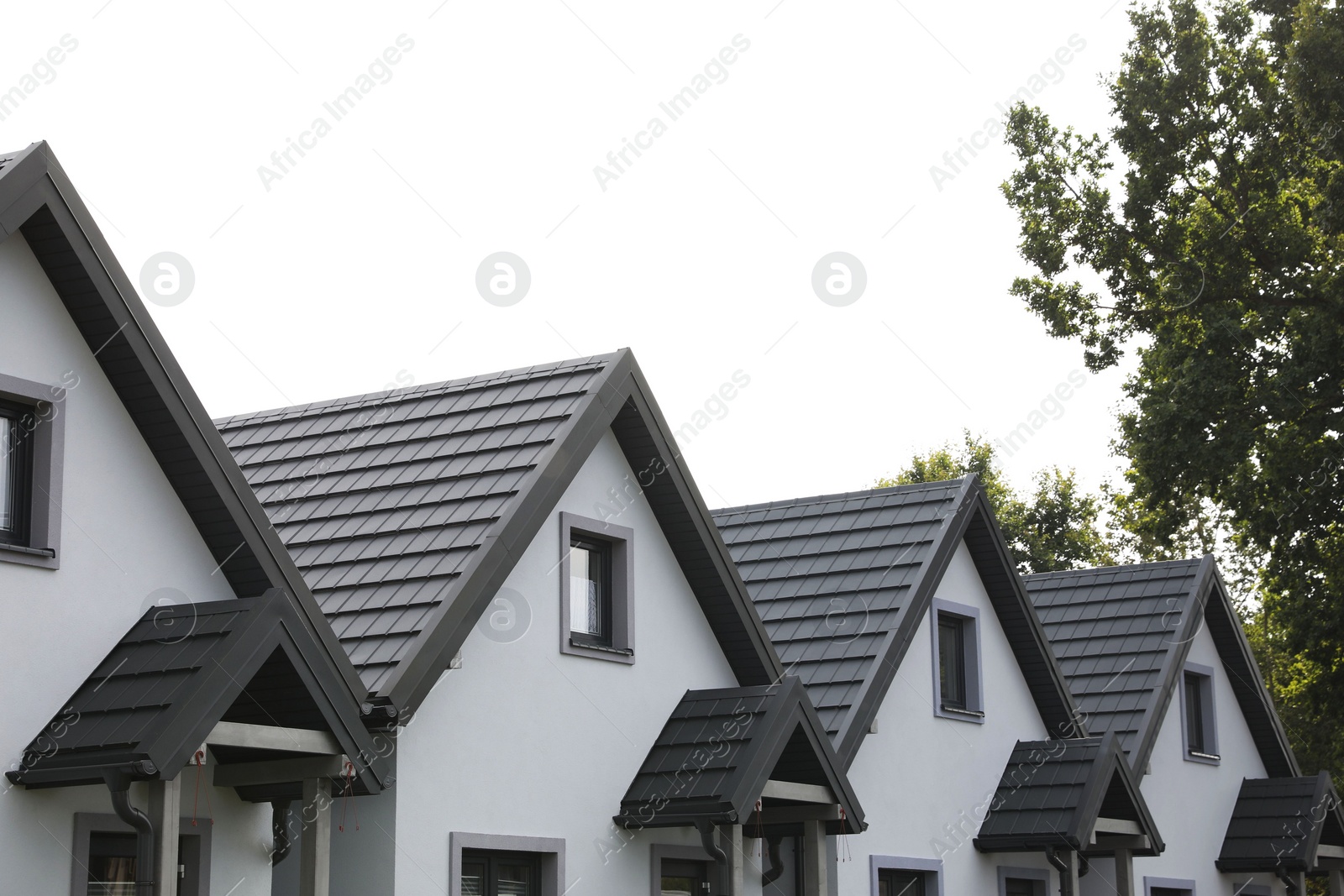 Photo of Beautiful beach houses and green trees outdoors