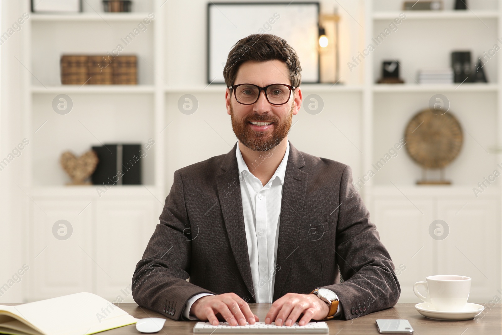 Photo of Happy businessman having online video call at desk in office, view from web camera