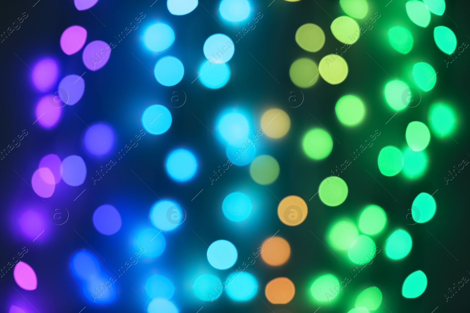 Photo of Beautiful lights on dark background. Bokeh effect