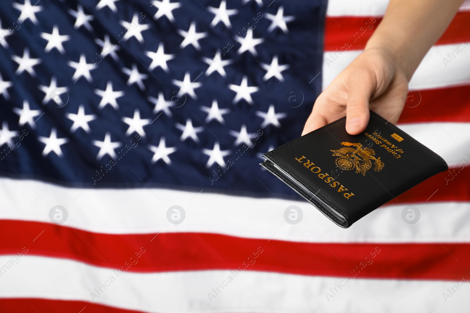 Photo of Woman holding passport against flag of USA, closeup with space for text