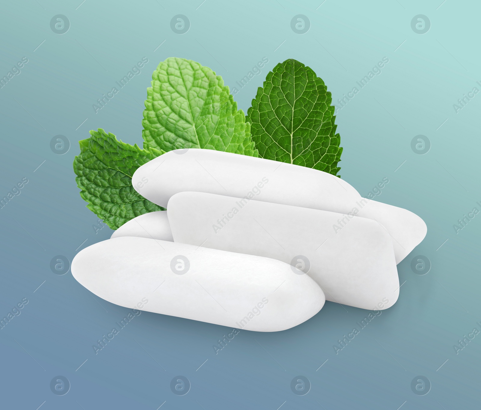 Image of Menthol chewing gum pillows and mint leaves on greyish blue background