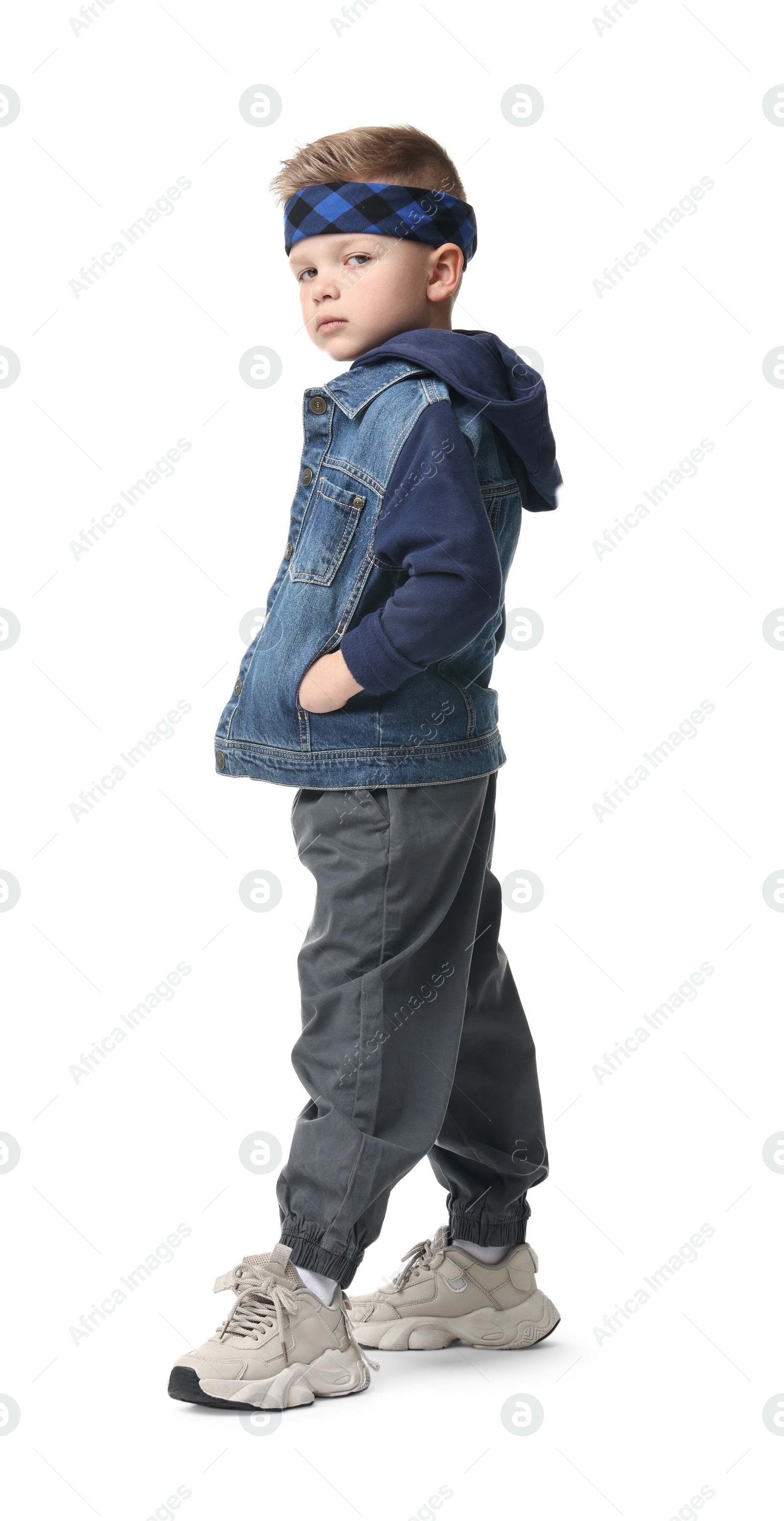 Photo of Happy little boy dancing on white background