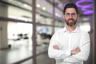 Image of Handsome confident man with eyeglasses in office, space for text